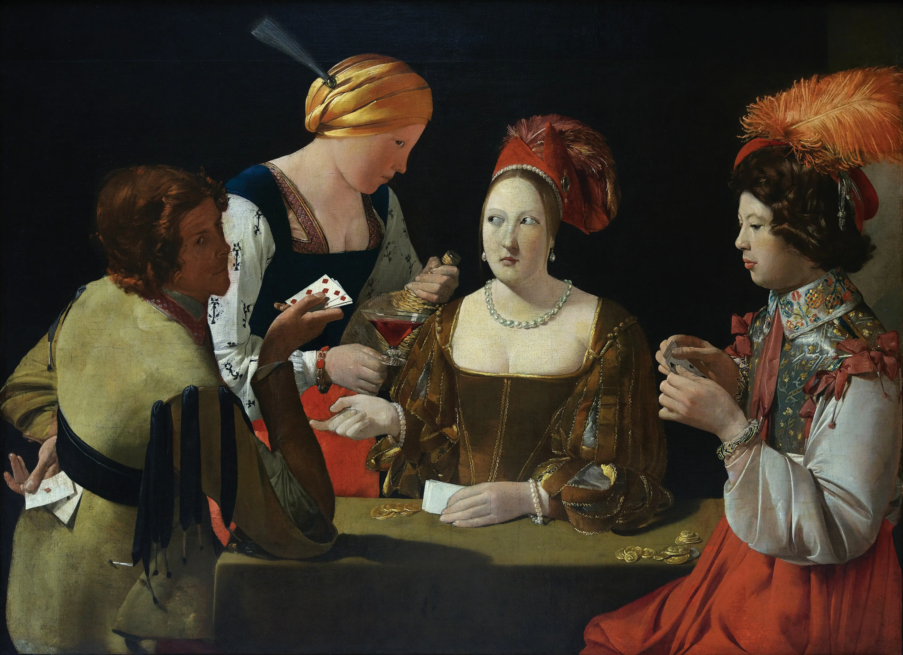 A candlelit card game: a young man in rich clothes studies his cards while a woman, a servant pouring wine and a player hiding an ace of diamonds behind his back exchange sideways glances