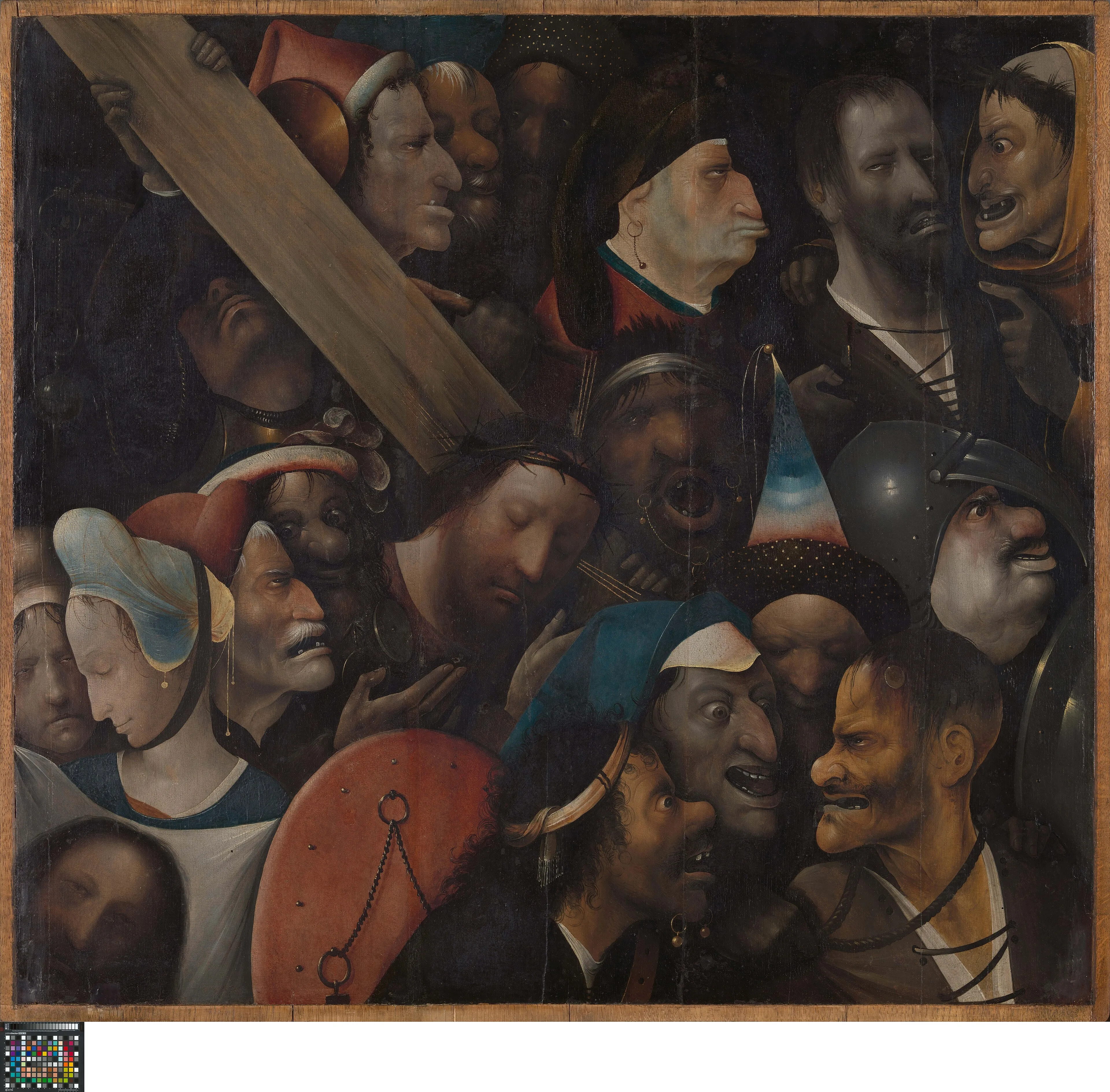 Painting of Christ carrying the cross and the two thieves, packed in by a crowd of grotesque heads