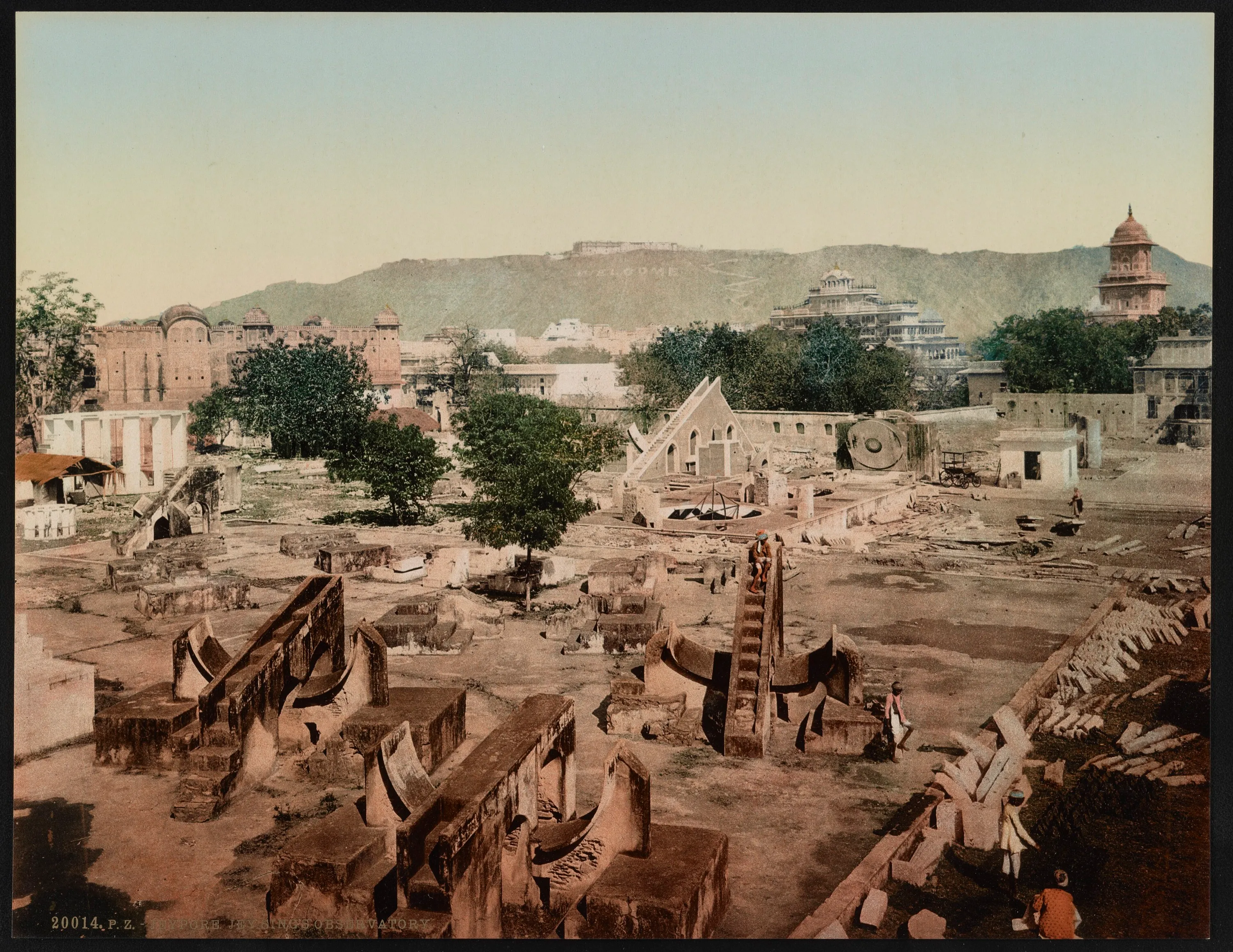 A colour-tinted photograph of the stone instruments of the Jantar Mantar observatory in Jaipur, with large curved and stepped masonry structures