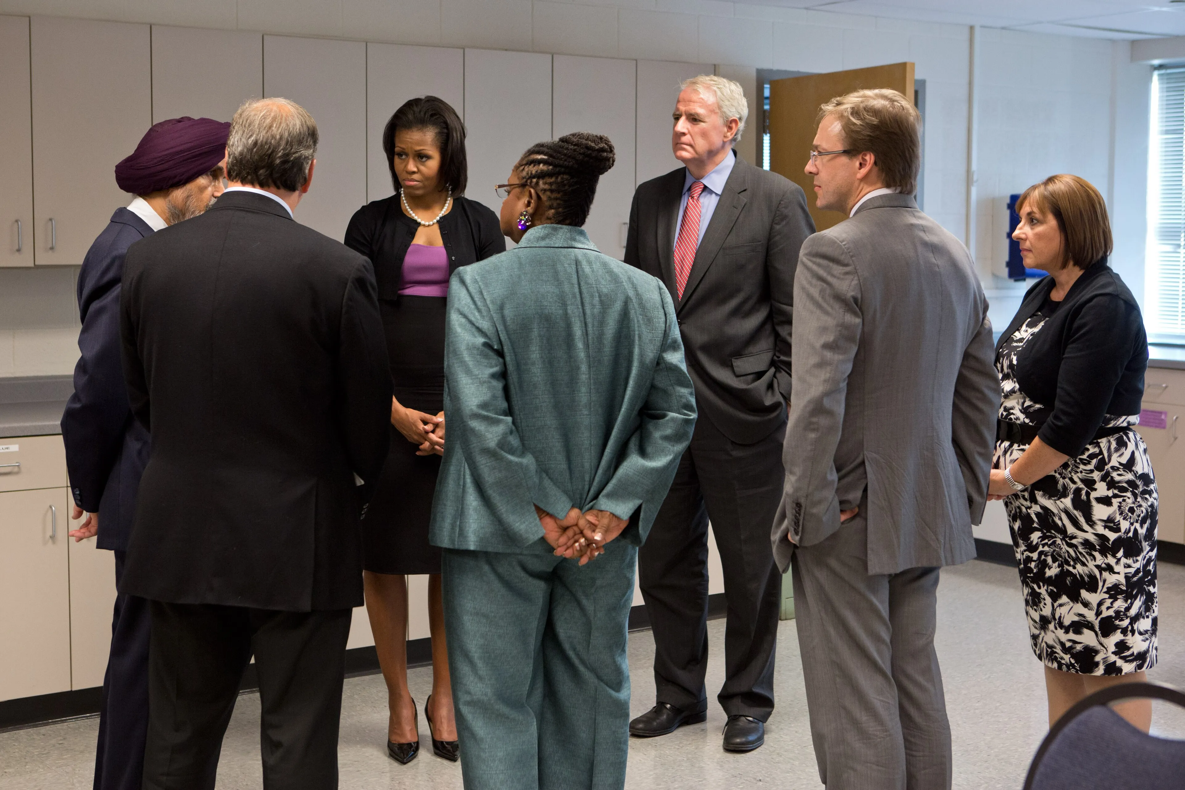 Michelle Obama talking with community leaders and local officials at Oak Creek High School after the gurdwara shooting