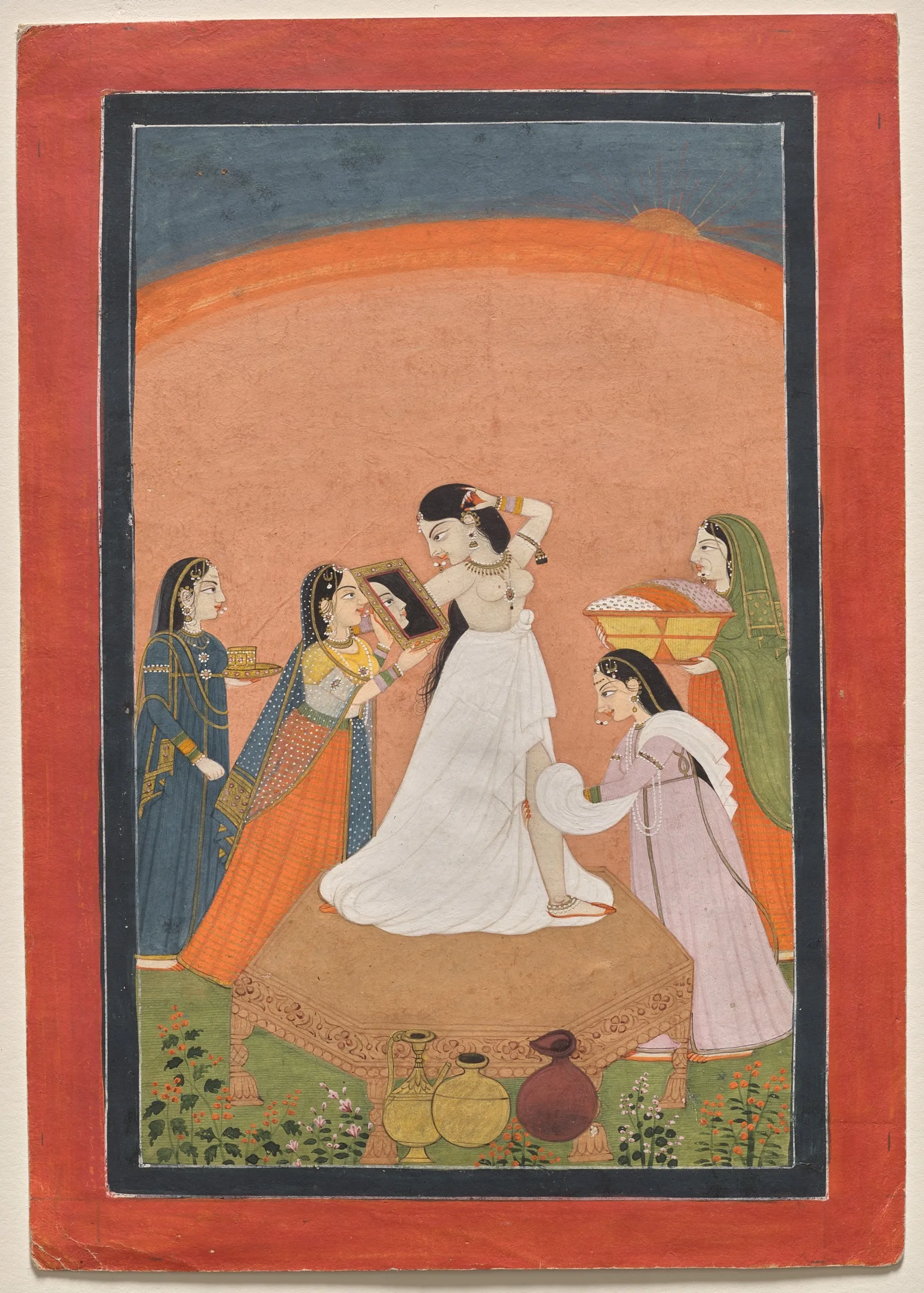 A Pahari miniature of a lady seated on a terrace at her morning toilette, one attendant holding up a mirror and others waiting with vessels and cloths