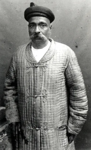A formal portrait photograph of Bal Gangadhar Tilak, wearing a turban and a shawl, with a moustache